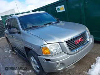 2004 GMC Envoy SLE with VIN 1GKDS13SX42134642, listed as a IAAI auction lot 41715419 with 173,661 mi miles. Bid and sale history available at carsss.com. Image 1.