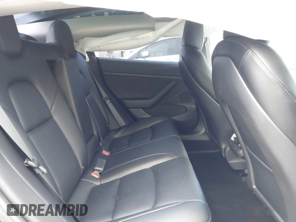 2021 Tesla Model 3 Standard Range Plus z VIN 5YJ3E1EA9MF020860, wystawiony jako IAAI lot #42246074 z przebiegiem 52 674 mil mil oraz . Historia ofert i sprzedaży dostępna na DreamBid. Obrazek 8.