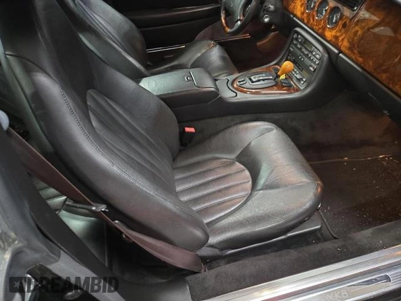 1997 Jaguar XK with VIN SAJGX5748VC006720, listed as a Copart auction lot 80928284 with 96,279 mi miles and Clean Title. Bid and sale history available at DreamBid. Image 5.