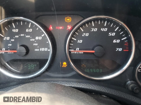 2013 Jeep Wrangler Sport with VIN 1C4AJWAG0DL696928, listed as a Copart auction lot 60822915 with 169,503 mi miles and Salvage title. Bid and sale history available at DreamBid. Image 9.