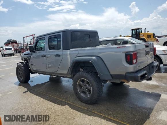 2020 Jeep Gladiator Sport S with VIN 1C6JJTAG9LL149872, listed as a Copart auction lot 58518095 with 118,910 mi miles and Salvage title. Bid and sale history available at DreamBid. Image 2.