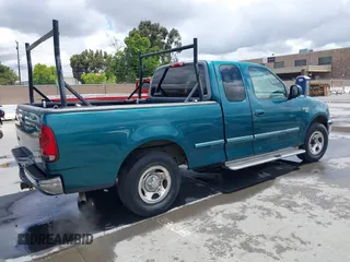 1998 Ford F-150 with VIN 1FTZX1760WKA90900, listed as a IAAI auction lot 42239510 with 198,405 mi miles and . Bid and sale history available at DreamBid. Image 4.