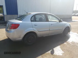 2011 Kia Rio with VIN KNADH4B32B6915275, listed as a Copart auction lot 71546484 with 297,998 mi miles and Salvage Title. Bid and sale history available at DreamBid. Image 3.