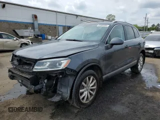 2015 Volkswagen Touareg Lux with VIN WVGEF9BPXFD005562, listed as a Copart auction lot 64482655 with 184,463 mi miles and Salvage title. Bid and sale history available at DreamBid. Image 1.