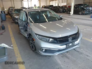 2021 Honda Civic Touring z VIN 19XFC1F97ME202456, wystawiony jako IAAI lot #42121387 z przebiegiem 55 230 mil mil oraz . Historia ofert i sprzedaży dostępna na DreamBid. Obrazek 1.