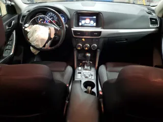 2016 Mazda CX-5 Touring z VIN JM3KE4CY5G0852073, wystawiony jako Copart lot #56599055 z przebiegiem 72 167 mil mil oraz Szkoda całkowita • Salvage title. Historia ofert i sprzedaży dostępna na DreamBid. Obrazek 8.