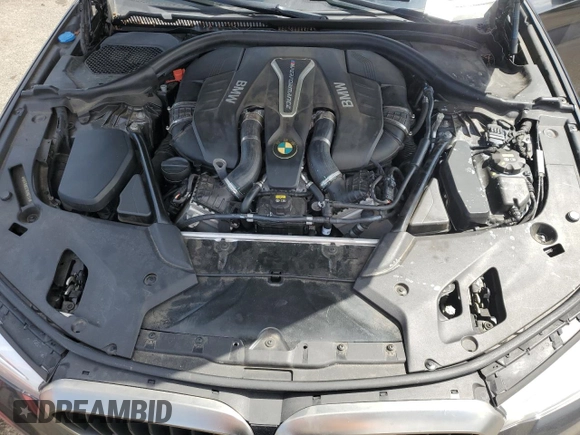 2018 BMW 5 Series M550i xDrive with VIN WBAJB9C57JB286734, listed as a Copart auction lot 52711235 with 127,450 mi miles and Salvage title. Bid and sale history available at DreamBid. Image 11.