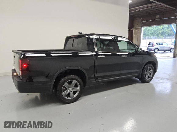 2023 Honda Ridgeline RTL-E with VIN 5FPYK3F79PB038896, listed as a Copart auction lot 58401225 with 23,531 mi miles and Clean title. Bid and sale history available at DreamBid. Image 3.