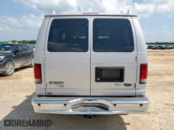 2009 Ford Econoline Passenger XL with VIN 1FBNE31L39DA56400, listed as a Copart auction lot 59878595 with 249,112 mi miles and Salvage title. Bid and sale history available at DreamBid. Image 6.