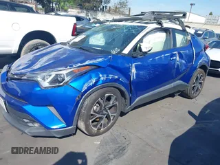 2019 Toyota C-HR XLE with VIN JTNKHMBX5K1043079, listed as a IAAI auction lot 41813367 with 77,879 mi miles and . Bid and sale history available at DreamBid. Image 2.