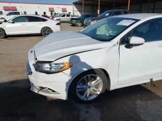 2018 Ford Fusion Hybrid SE with VIN 3FA6P0LU7JR188124, listed as a IAAI auction lot 41760184 with 74,731 mi miles. Bid and sale history available at carsss.com. Image 6.