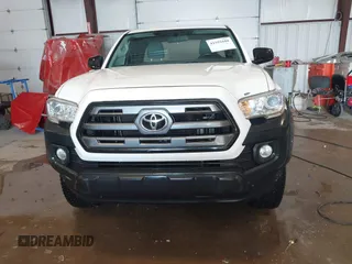 2016 Toyota Tacoma SR z VIN 5TFSX5ENXGX042148, wystawiony jako IAAI lot #41592688 z przebiegiem 126 528 mil mil oraz . Historia ofert i sprzedaży dostępna na DreamBid. Obrazek 12.