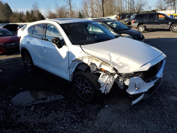 2018 Mazda CX-5 Grand Touring z VIN JM3KFBDM6J0337006, wystawiony jako Copart lot #87155694 z przebiegiem 50 643 mil mil oraz Szkoda całkowita • Salvage title. Historia ofert i sprzedaży dostępna na DreamBid. Obrazek 4.