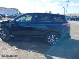 2018 Toyota RAV4 LE with VIN JTMBFREV1JJ743018, listed as a IAAI auction lot 41974309 with 59,135 mi miles. Bid and sale history available at carsss.com. Image 15.