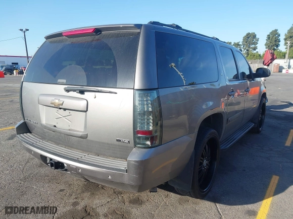 2009 Chevrolet Suburban LT w/2LT with VIN 1GNFC26069R190780, listed as a IAAI auction lot 41966765 with 206,413 mi miles. Bid and sale history available at carsss.com. Image 4.