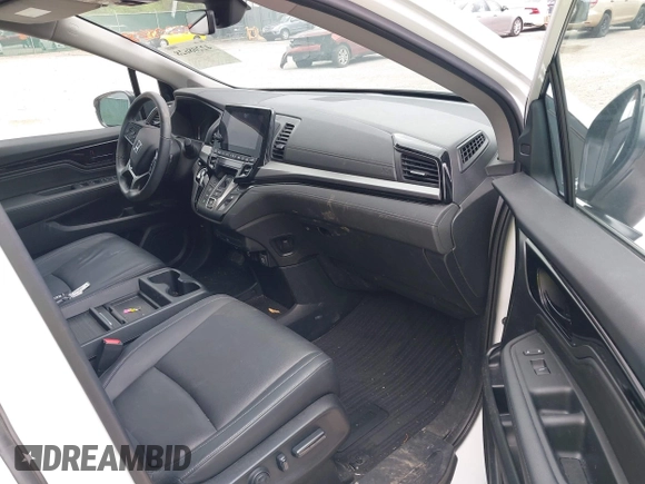 2023 Honda Odyssey Touring with VIN 5FNRL6H88PB079716, listed as a IAAI auction lot 42208628 with 26,679 mi miles and . Bid and sale history available at DreamBid. Image 5.
