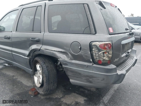 2004 Jeep Grand Cherokee Laredo with VIN 1J4GX48S14C177923, listed as a IAAI auction lot 41745772 with 242,506 mi miles. Bid and sale history available at carsss.com. Image 6.