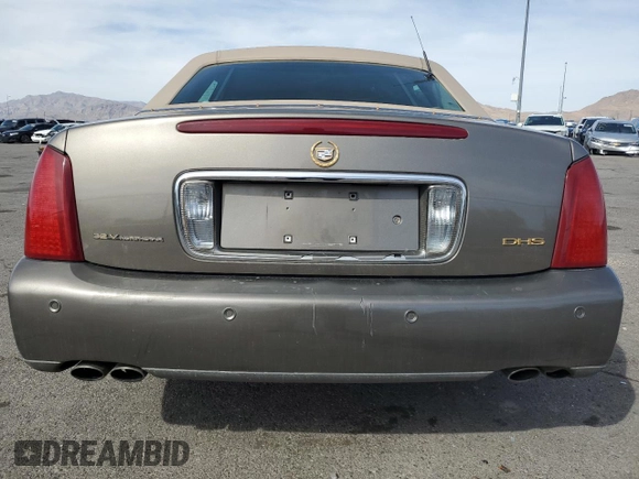 2002 Cadillac DeVille DHS z VIN 1G6KE57Y22U291523, wystawiony jako Copart lot #45711095 z przebiegiem 160 364 mil mil oraz Szkoda całkowita • Salvage title. Historia ofert i sprzedaży dostępna na DreamBid. Obrazek 6.