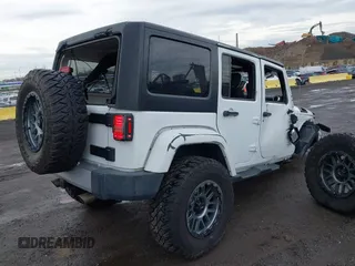 2015 Jeep Wrangler Unlimited Sahara with VIN 1C4BJWEG5FL518191, listed as a IAAI auction lot 41914581 with 107,433 mi miles. Bid and sale history available at carsss.com. Image 17.