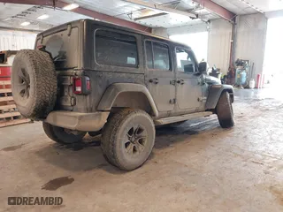2020 Jeep Wrangler Unlimited Sport Altitude with VIN 1C4HJXDG4LW120627, listed as a IAAI auction lot 41728593 with 63,565 mi miles. Bid and sale history available at carsss.com. Image 4.