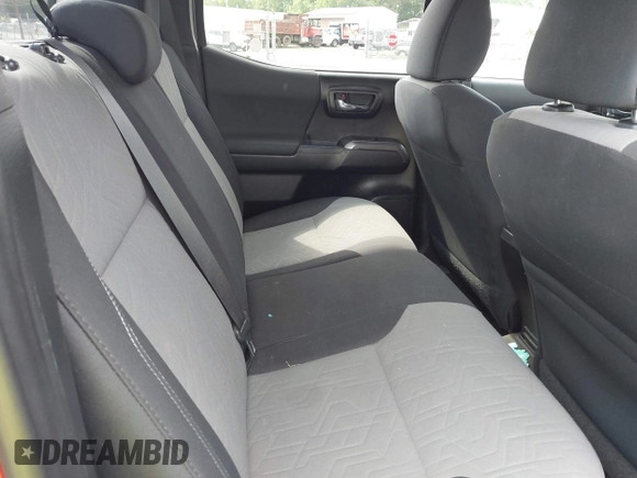 2021 Toyota Tacoma SR z VIN 5TFCZ5AN2MX263159, wystawiony jako IAAI lot #42273087 z przebiegiem 69 220 mil mil oraz . Historia ofert i sprzedaży dostępna na DreamBid. Obrazek 8.