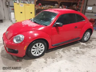 2016 Volkswagen Beetle Coupe 1.8T Wolfsburg Edition with VIN 3VWF17AT2GM619843, listed as a IAAI auction lot 41829023 with 147,716 mi miles. Bid and sale history available at carsss.com. Image 17.