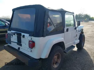 2002 Jeep Wrangler Sahara with VIN 1J4FA59S62P772256, listed as a IAAI auction lot 41968844 with 170,218 mi miles. Bid and sale history available at carsss.com. Image 4.