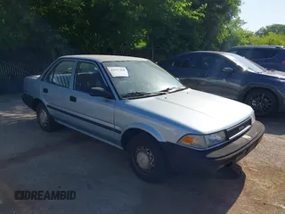 1990 Toyota Corolla z VIN JT2AE94A1L3367594, wystawiony jako IAAI lot #42557468 z przebiegiem 136 600 mil mil oraz . Historia ofert i sprzedaży dostępna na DreamBid. Obrazek 1.