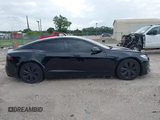 2022 Tesla Model S with VIN 5YJSA1E51NF472152, listed as a IAAI auction lot 42625943 with 60,290 mi miles and . Bid and sale history available at DreamBid. Image 12.
