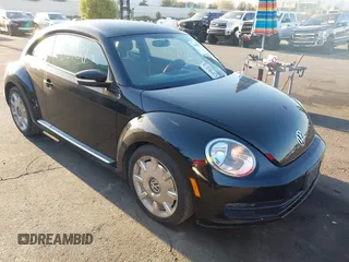 2012 Volkswagen Beetle 2.5L w/Sound/Nav PZEV with VIN 3VWJP7AT7CM661055, listed as a IAAI auction lot 41980159 with 113,678 mi miles and . Bid and sale history available at DreamBid. Image 1.