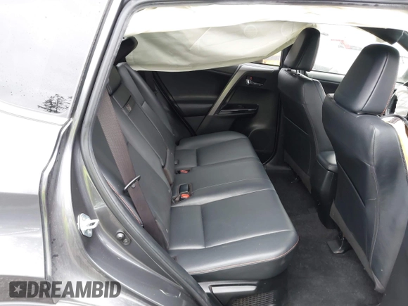 2018 Toyota RAV4 Hybrid SE with VIN JTMJJREV7JD208249, listed as a IAAI auction lot 41859301 with 91,899 mi miles and . Bid and sale history available at DreamBid. Image 8.