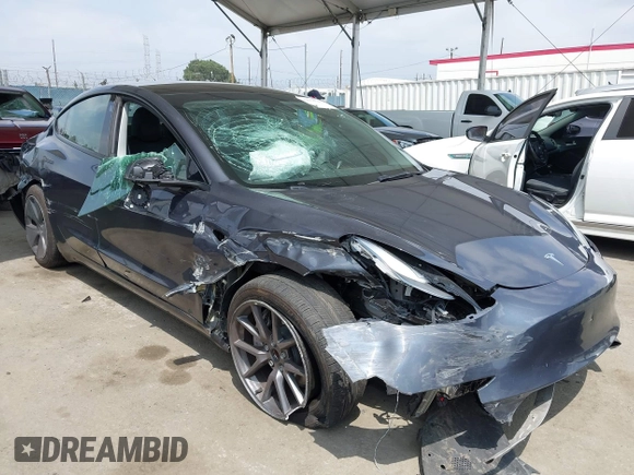 2023 Tesla Model 3 with VIN 5YJ3E1EA0PF518904, listed as a IAAI auction lot 42058540 with 20,945 mi miles and . Bid and sale history available at DreamBid. Image 1.