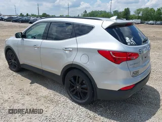 2013 Hyundai Santa Fe Sport z VIN 5XYZUDLA8DG055576, wystawiony jako IAAI lot #42392636 z przebiegiem 165 096 mil mil oraz . Historia ofert i sprzedaży dostępna na DreamBid. Obrazek 3.