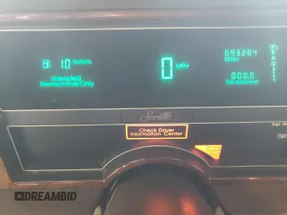 1991 Cadillac Seville z VIN 1G6KS53B5MU825563, wystawiony jako Copart lot #81541154 z przebiegiem 93 284 mil mil oraz Czysty tytuł • Clean title. Historia ofert i sprzedaży dostępna na DreamBid. Obrazek 9.