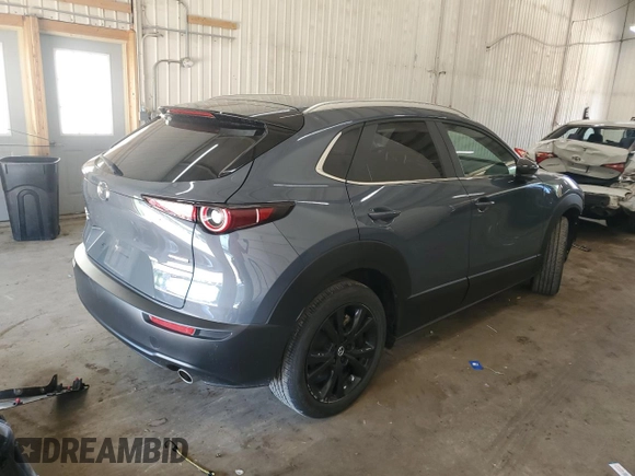2023 Mazda CX-30 S Preferred with VIN 3MVDMBCM0PM575057, listed as a Copart auction lot 63506665 with 47,556 mi miles and Salvage title. Bid and sale history available at DreamBid. Image 3.