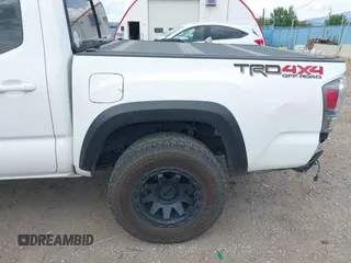 2022 Toyota Tacoma SR with VIN 3TMCZ5AN1NM478457, listed as a IAAI auction lot 42479107 with 59,547 mi miles and . Bid and sale history available at DreamBid. Image 18.