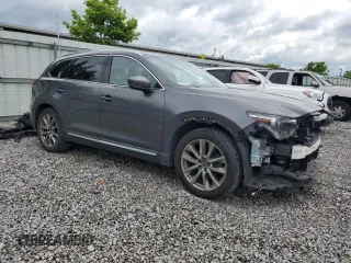 2018 Mazda CX-9 Grand Touring with VIN JM3TCADY7J0211781, listed as a Copart auction lot 59477885 with 77,667 mi miles and Salvage title. Bid and sale history available at DreamBid. Image 4.
