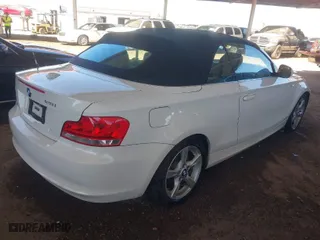 2013 BMW 1 Series 128i with VIN WBAUN1C55DVR01404, listed as a IAAI auction lot 41682695 with 100,948 mi miles. Bid and sale history available at carsss.com. Image 4.