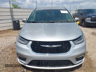 2023 Chrysler Pacifica Touring L with VIN 2C4RC1BG7PR521232, listed as a IAAI auction lot 42087909 with 34,609 mi miles and . Bid and sale history available at DreamBid. Image 11.