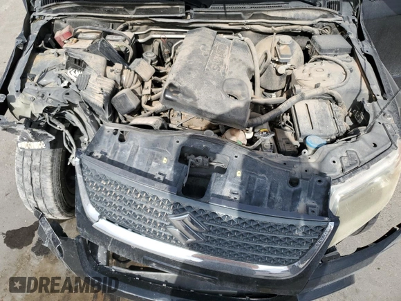2009 Suzuki Grand Vitara with VIN JS3TE044094100649, listed as a Copart auction lot 52033855 with 137,460 mi miles and Salvage title. Bid and sale history available at DreamBid. Image 12.