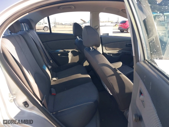 2009 Kia Rio SX with VIN KNADE223296523842, listed as a IAAI auction lot 42024905 with 98,613 mi miles. Bid and sale history available at carsss.com. Image 8.