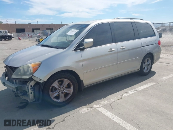 2009 Honda Odyssey Touring с VIN 5FNRL38969B013708, выставлен на аукционе IAAI как лот 42002538 с пробегом 198 220 миль миль и . История ставок и продаж доступна на DreamBid. Изображение 18.