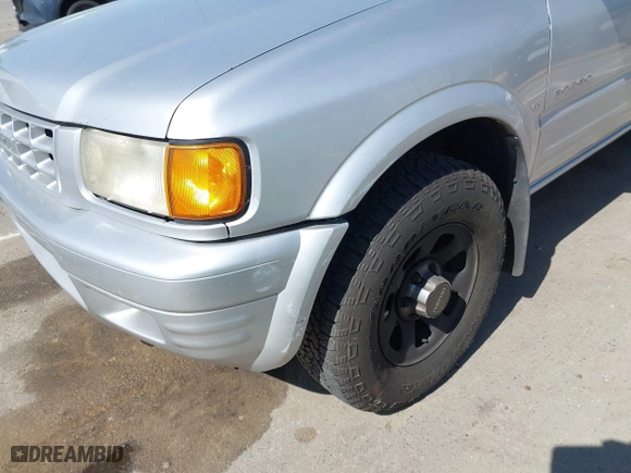 1998 Isuzu Rodeo S with VIN 4S2CM58WXW4325350, listed as a IAAI auction lot 42084411 with 292,784 mi miles. Bid and sale history available at carsss.com. Image 16.