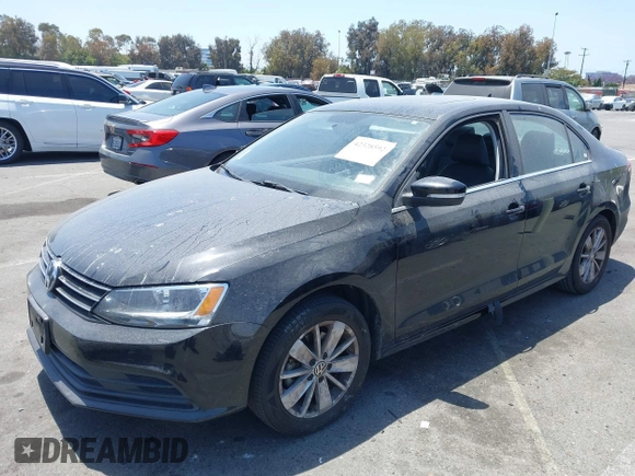 2015 Volkswagen Jetta SE z VIN 3VWD07AJ1FM284890, wystawiony jako IAAI lot #42328592 z przebiegiem 92 880 mil mil oraz . Historia ofert i sprzedaży dostępna na DreamBid. Obrazek 2.
