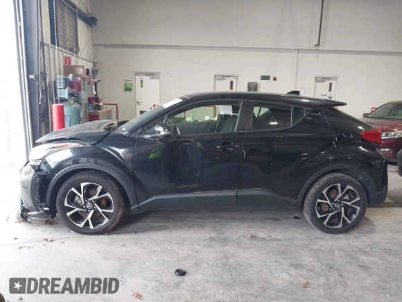 2020 Toyota C-HR LE with VIN JTNKHMBX1L1077957, listed as a IAAI auction lot 42159765 with 83,138 mi miles and . Bid and sale history available at DreamBid. Image 15.
