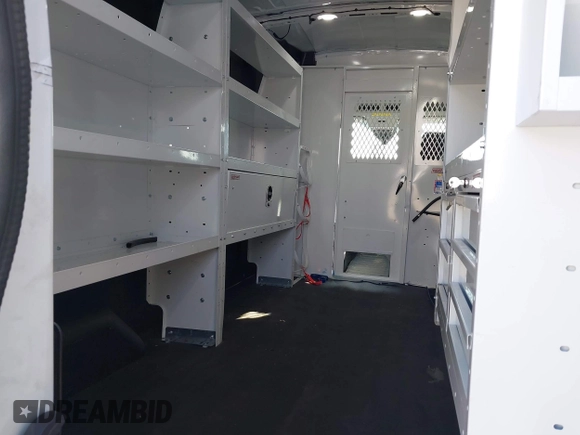 2023 Ford Transit Cargo with VIN 1FTBR1C85PKC08945, listed as a IAAI auction lot 41385685 with 5,577 mi miles and . Bid and sale history available at DreamBid. Image 8.