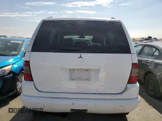 2000 Mercedes-Benz M-Class with VIN 4JGAB54E5YA165660, listed as a Copart auction lot 65872364 with 115,668 mi miles and Salvage Title. Bid and sale history available at carsss.com. Image 6.