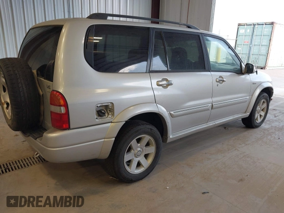 2003 Suzuki XL7 Touring z VIN JS3TX92V434101918, wystawiony jako IAAI lot #42750098 z przebiegiem 261 451 mil mil oraz . Historia ofert i sprzedaży dostępna na DreamBid. Obrazek 4.