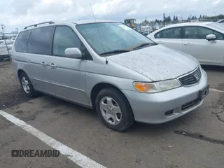 2001 Honda Odyssey EX z VIN 2HKRL18671H614982, wystawiony jako IAAI lot #41901077 z przebiegiem 180 174 mil mil oraz . Historia ofert i sprzedaży dostępna na DreamBid. Obrazek 1.