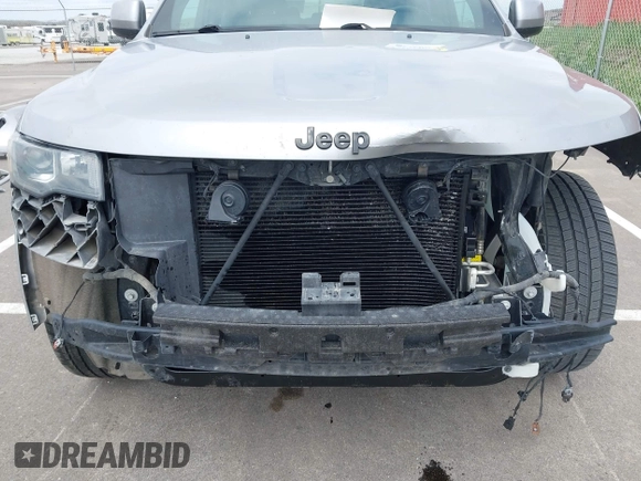 2017 Jeep Grand Cherokee Laredo with VIN 1C4RJFAG1HC701921, listed as a IAAI auction lot 42164963 with 135,039 mi miles and . Bid and sale history available at DreamBid. Image 6.